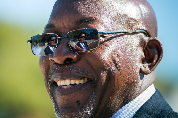 Mike Mizwa, COO of BIPAI is reflected in the glasses of Dr. Gabriel Anabwani, executive director of the Botswana-Baylor Children's Centre of Excellence. (Photo by Smiley N. Pool)