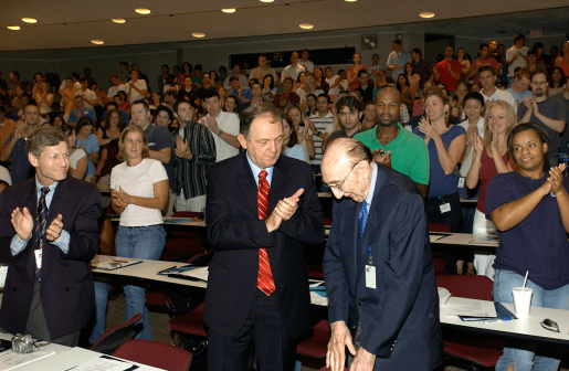 Tulane University School of Medicine students and, from left, Dr. Ian L. Taylor, Tulane's Associate Senior Vice President for the Health Sciences and Dean, School of Medicine and Dr. N. Kevin Krane, Tulane's Vice Dean for Academic Affairs, give Dr. Michael E. DeBakey a standing ovation during Tulane's orientation at Baylor College of Medicine.