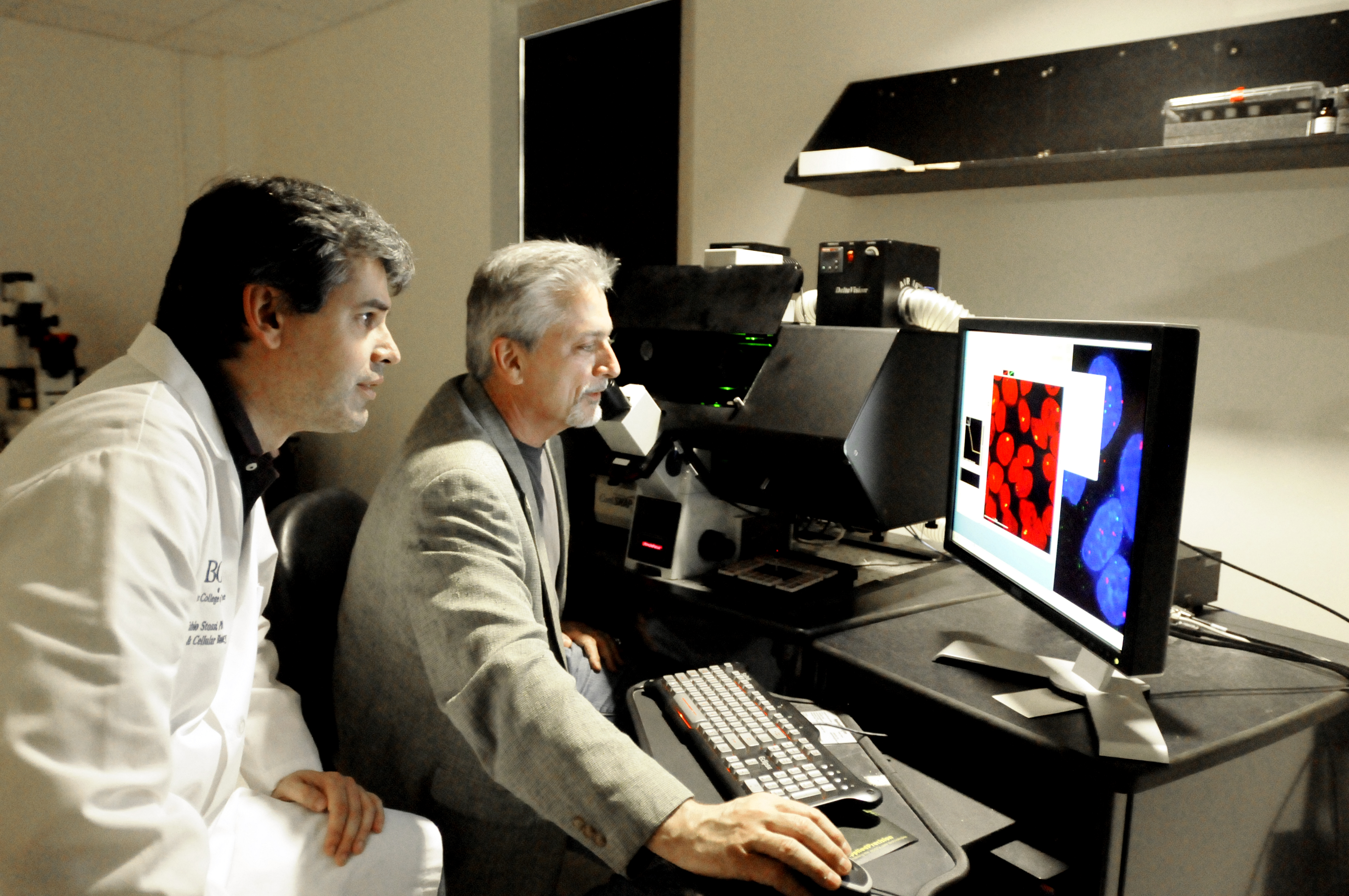 Dr. Fabio Stossi, assistant professor of molecular and cellular biology at Baylor, and Dr. Michael A. Mancini, professor and director of the Integrated Microscopy Core at Baylor. 