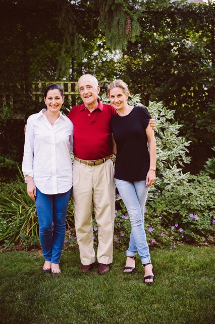 Carrie Davis Lebovich, left, and Hadley Davis Rierson, right, pose for a photo with their father.