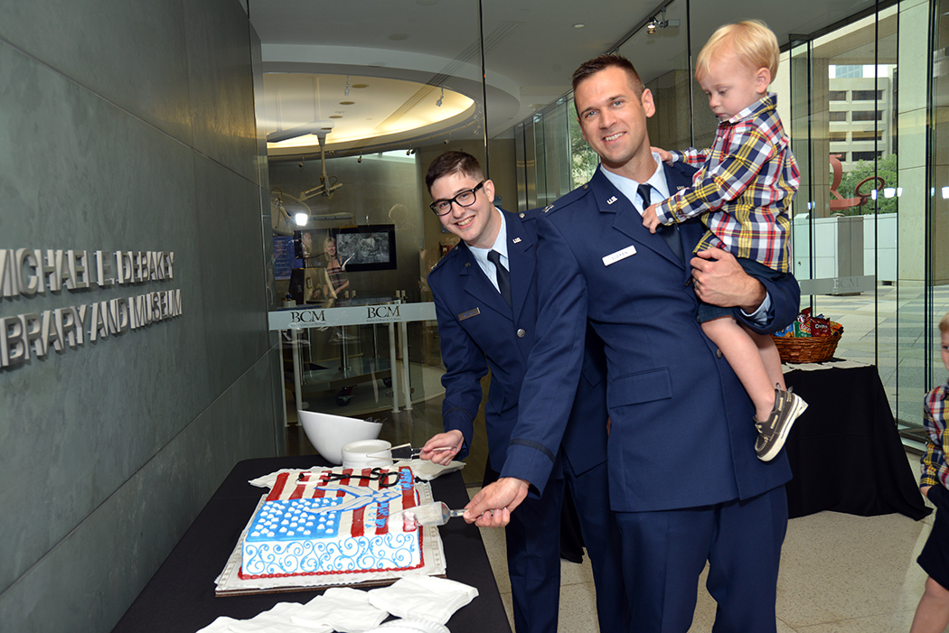 Cecil Roberts and Tim Soeken cut the cake following their Military Commissioning Ceremony.