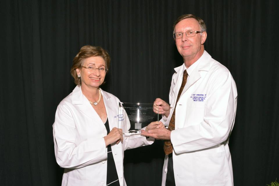 Dr. Ellen Friedman, left, director of the Center for Professionalism in Medicine at Baylor College of Medicine presents the 2015 Ben and Margaret Love Foundation Bobby Alford Award for Academic Clinical Professionalism to Dr. C. Kent Osborne.