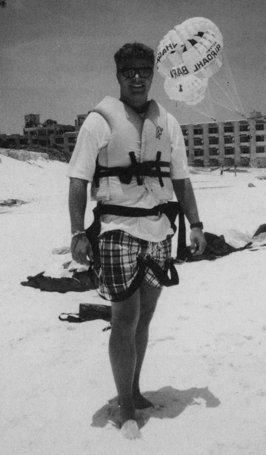 A student on vacation in Cancun poses following a parasailing trip.parasail
