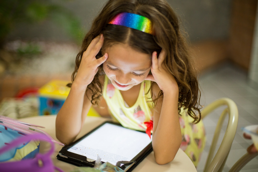 child-at-table-with-tablet