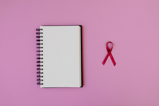 breast-cancer-ribbon-and-notepad