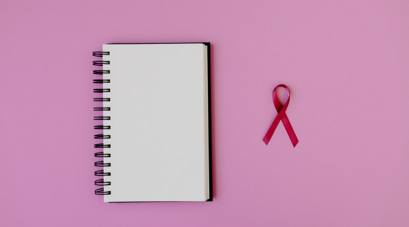 breast-cancer-ribbon-and-notepad