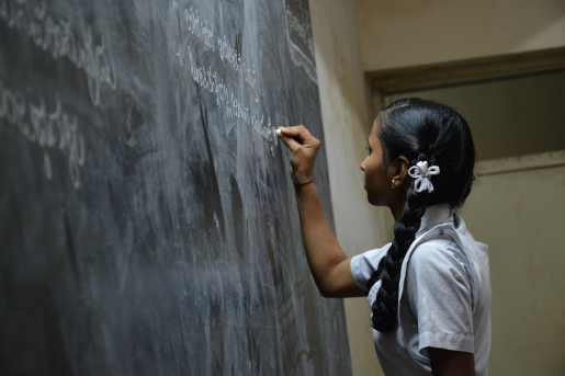 girl-in-school-with-chalkboard