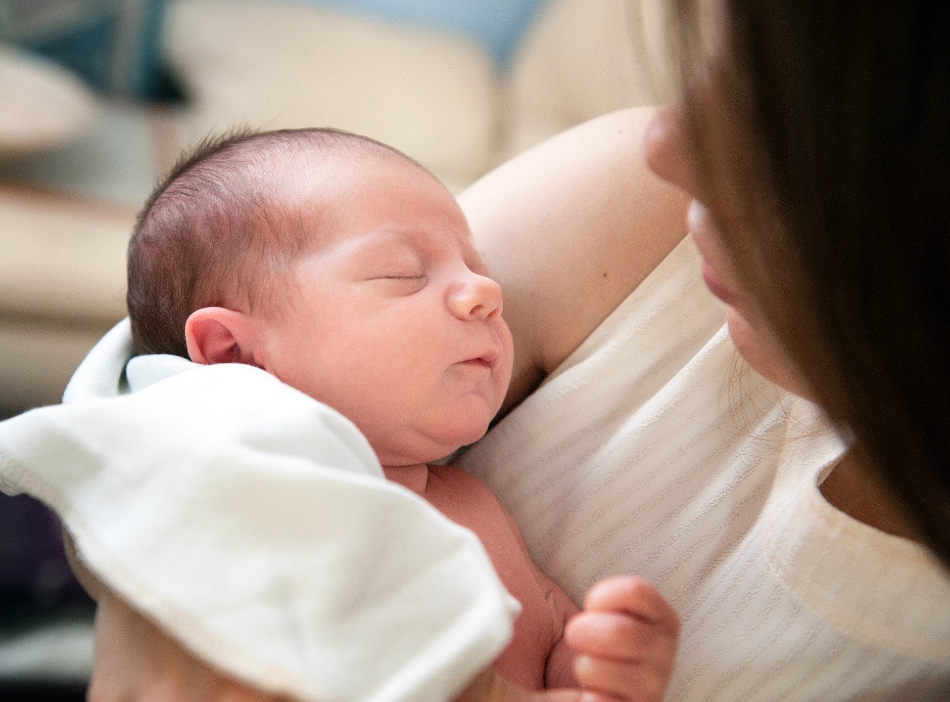 A mother with a newborn child.