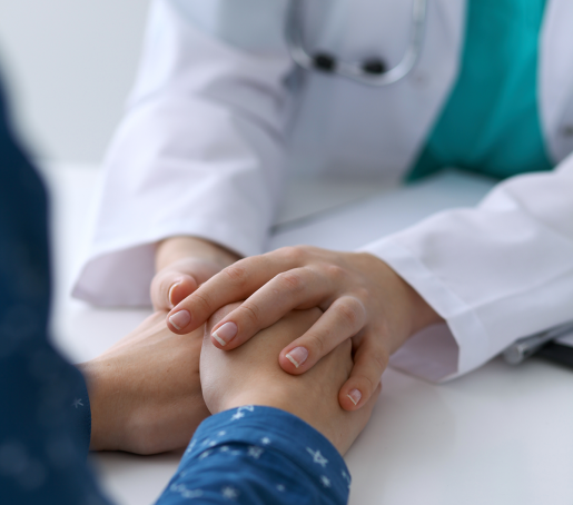 A doctor comforting a patient