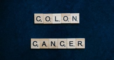 The words "colon cancer" spelled out in Scrabble tiles