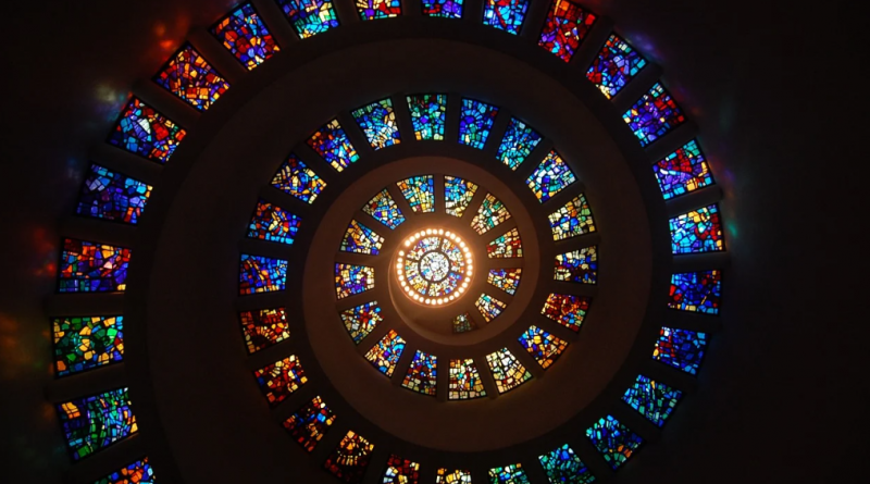 A spiraling collection of stained glass windows.