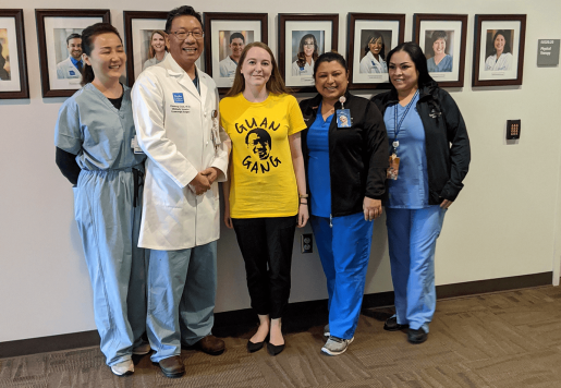 Alison Landolt stands with Dr. Guan and his team.