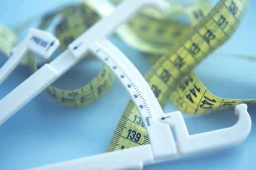 A variety of tape measures on a tables.