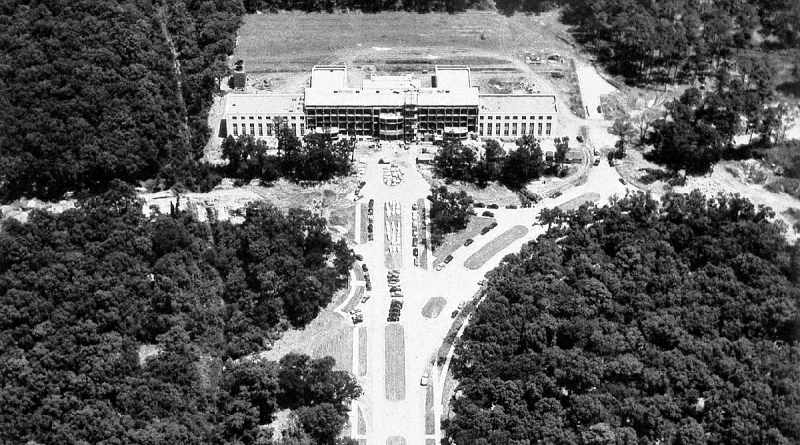 The Cullen building, mid-construction, as seen from above. Unlike today, the area around the building is a full forest.
