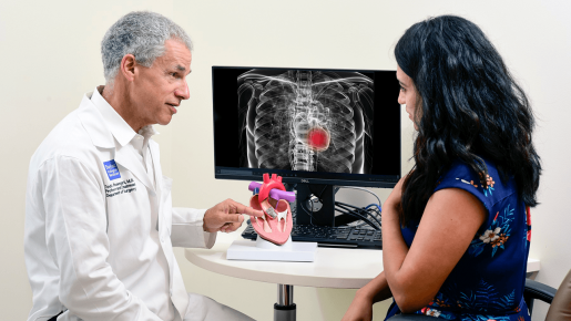 Dr. Todd Rosengart shows a patient a chest x-ray.