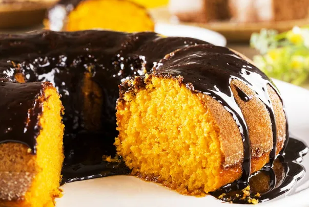 A rich yellow ring cake drizzled with chocolate.