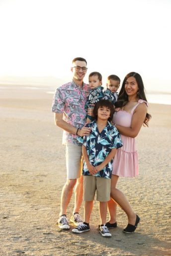 Jasmariah Swenson, her husband and their three children smiling on a beach