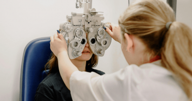 A doctor giving an eye exam.