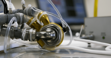 A BiVACOR total artificial heart attached to mock circulation loop for pump hydraulics performance testing.