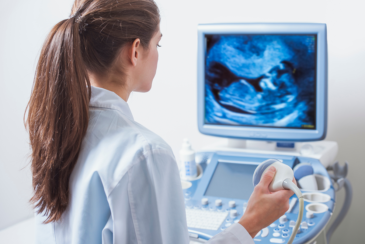 A doctor viewing an ultrasound result.