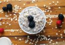 Picture of breakfast oatmeal with mixed berries and almond slices.