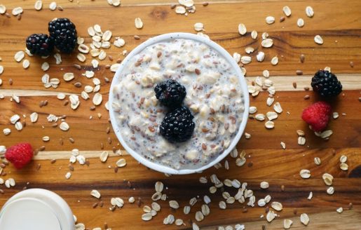 Picture of breakfast oatmeal with mixed berries and almond slices.