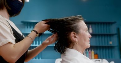 Older woman having her hair cut at a salon.