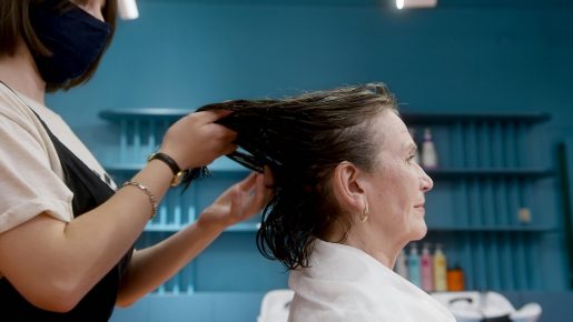 Older woman having her hair cut at a salon.