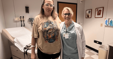 Jessica Wilbourn and Dr. Lauren Barron stand together in an exam room.