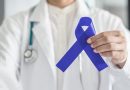 Doctor holding colon cancer awareness ribbon