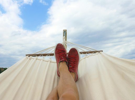 Man relaxing in a hammock.