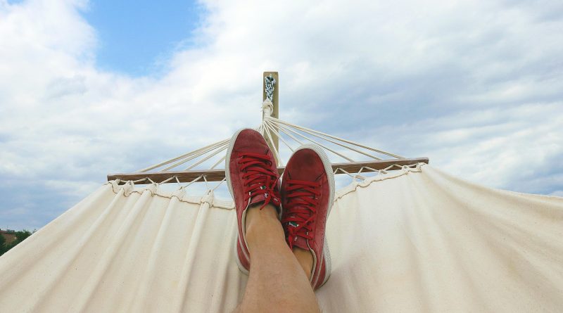 Man relaxing in a hammock.