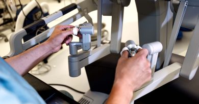 Surgeon performing robotic surgery.