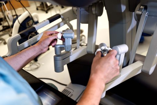 Surgeon performing robotic surgery.