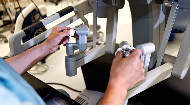 Surgeon performing robotic surgery.