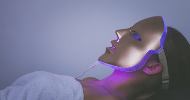 Woman with LED Light Therapy mask on her face.