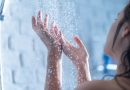 A woman's two hands in the shower.