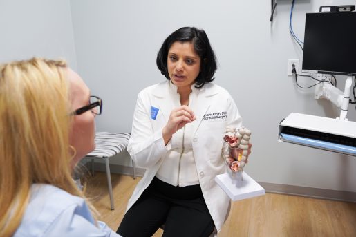 Dr. Punam Amin speaking with a patient.