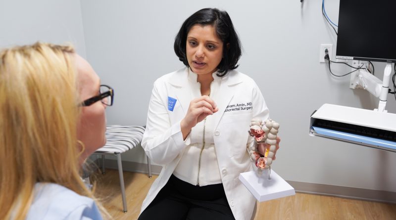 Dr. Punam Amin speaking with a patient.