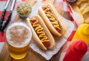 Two hot dogs with beer.