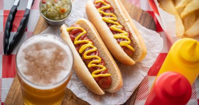 Two hot dogs with beer.