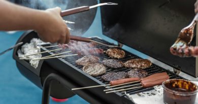 Person grilling meat.