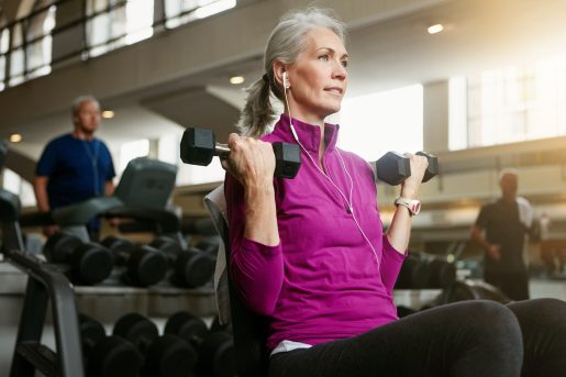 Woman holding dumbbells.