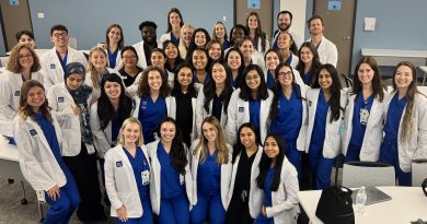 The Physician Assistant class of 2027 posing for a photo in classroom.
