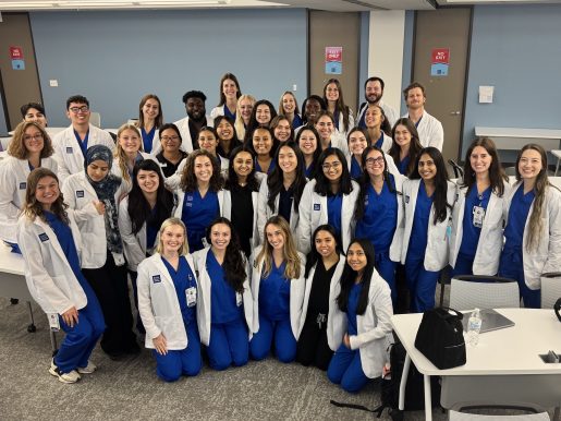 The Physician Assistant class of 2027 posing for a photo in classroom.