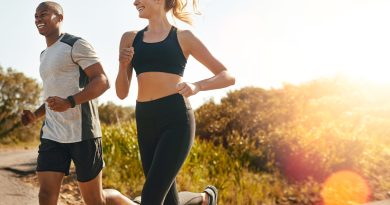 Two people running outside.