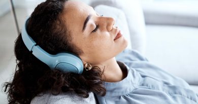 Woman relaxing in headphones.