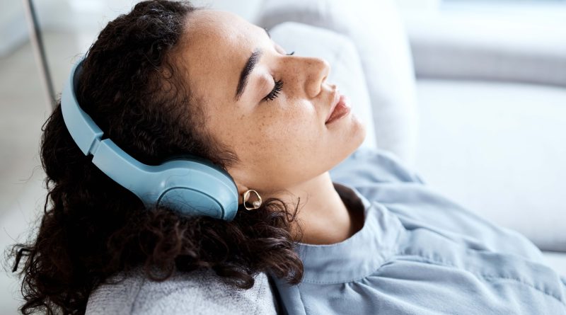 Woman relaxing in headphones.