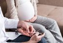 A person is checking blood sugar glucose of pregnant woman at home.