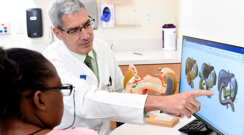 Dr. William Fisher with patient.
